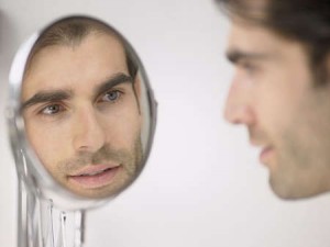 man-looking-in-mirror